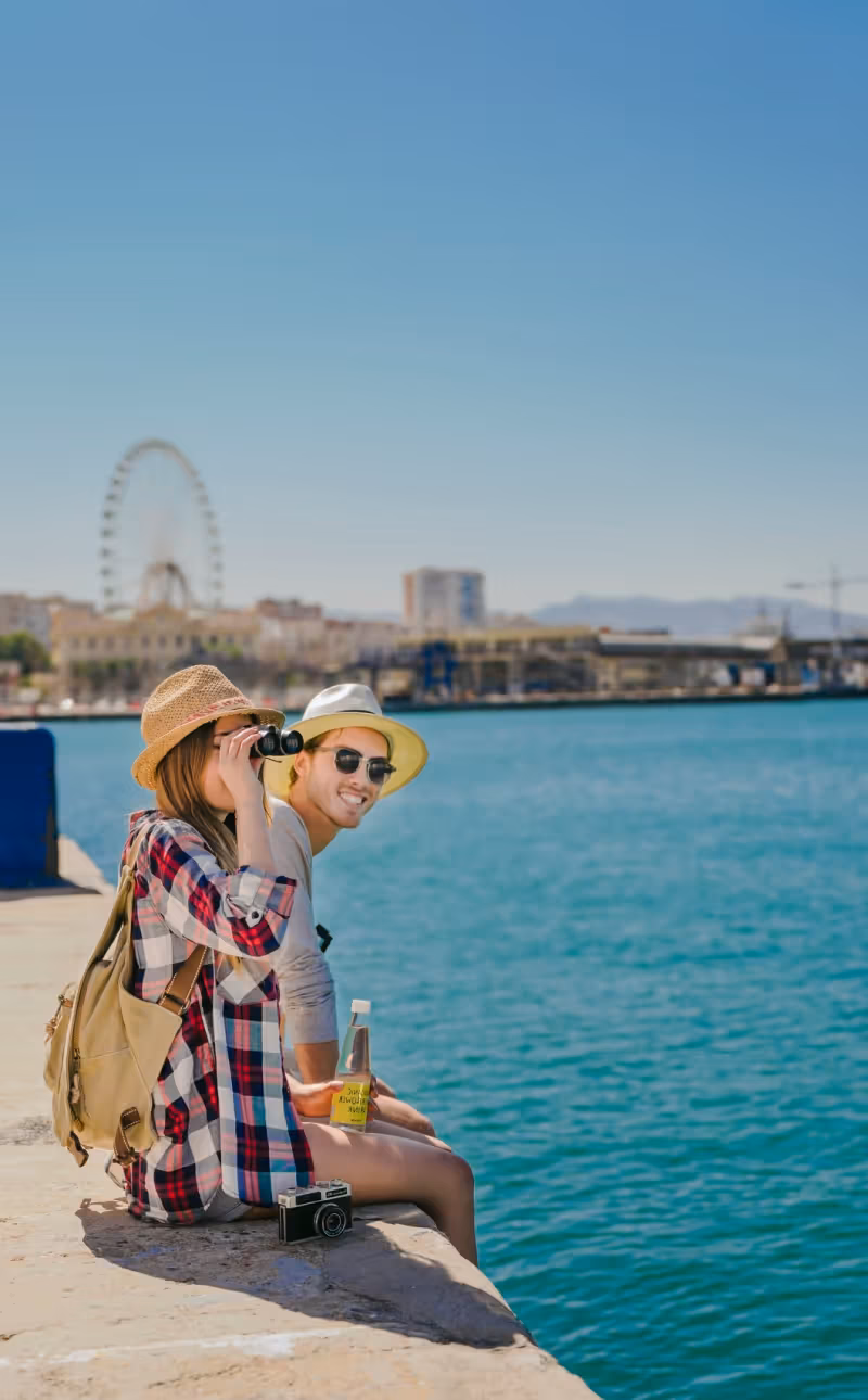 Travelers enjoying a seaside view